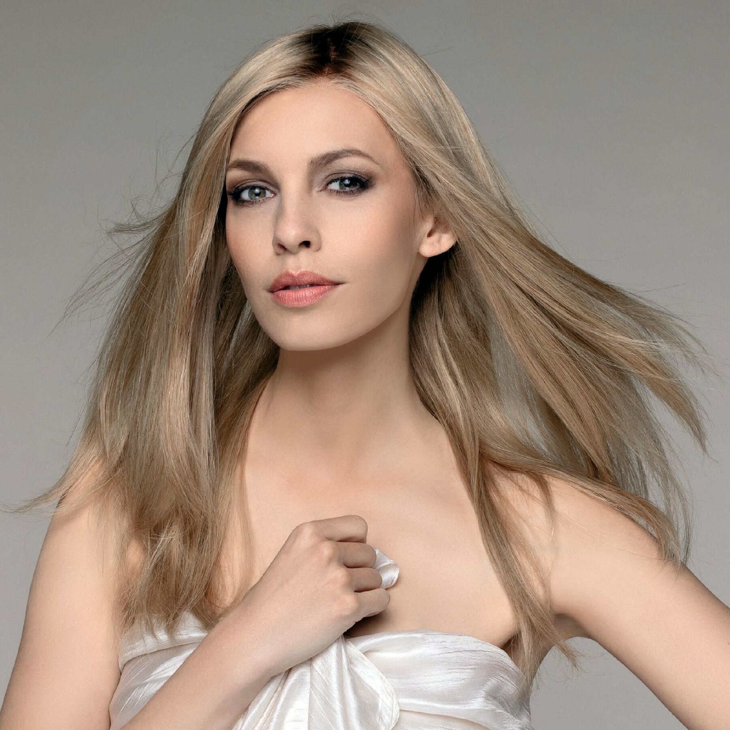 Emotion Deluxe human hair wig by Ellen Wille with long, sleek layers with lace front and monofilament top for natural movement