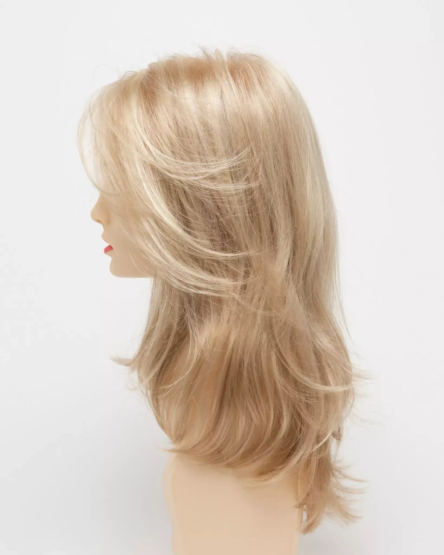 Side view of Bobbi wig by Envy in Medium Blonde featuring a mono top and lace front for comfort and natural scalp.