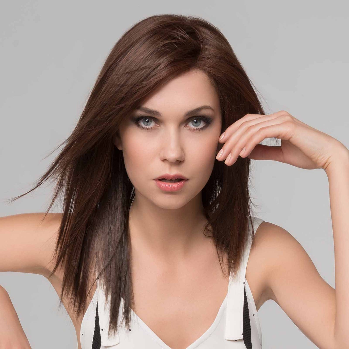 Code Mono Part wig by Ellen Wille from the Hairpower Collection – a long, layered synthetic wig with side-swept fringe and a mono part.