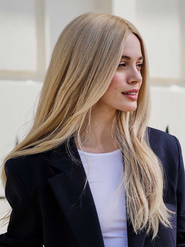 Front view of Diamond human hair wig by Gem in blonde, long-length Remy hair, lace front and monofilament top.