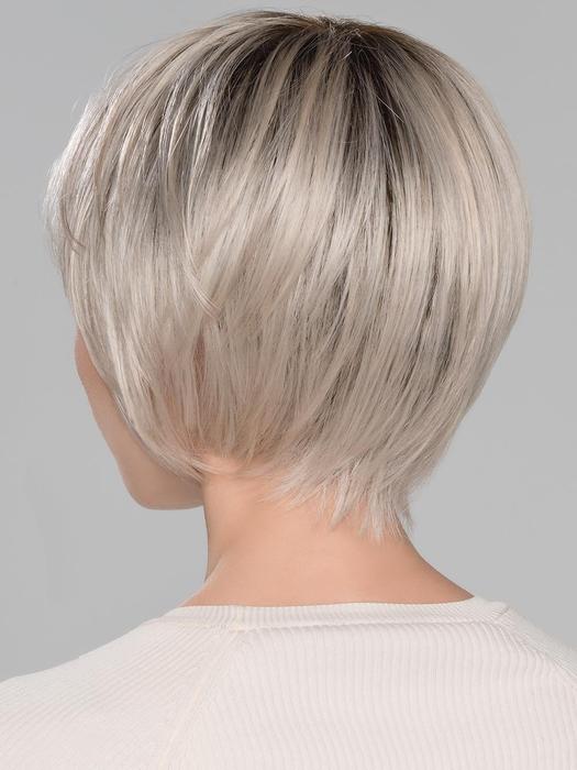 Back view of Beam wig by Ellen Wille in Light Champagne Rooted, a chic short bob with layers, fringe and mono crown.