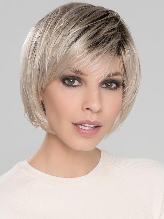 Front view of Beam wig by Ellen Wille in Light Champagne Rooted, a chic short bob with layers, fringe and mono crown.