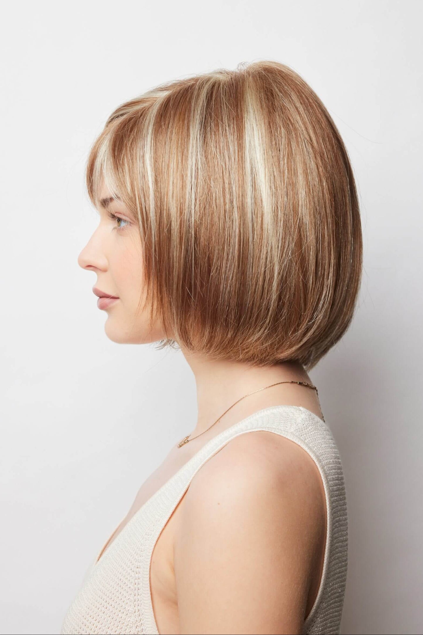 Erika wig by Amore in Strawberry Swirl – a collar length bob style made with a double monofilament cap construction.