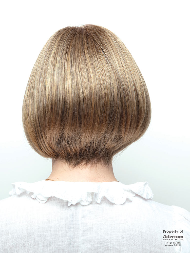 Back view of Erin wig by Amore – a chin-length bob with full fringe, double monofilament top in Harvest Gold.