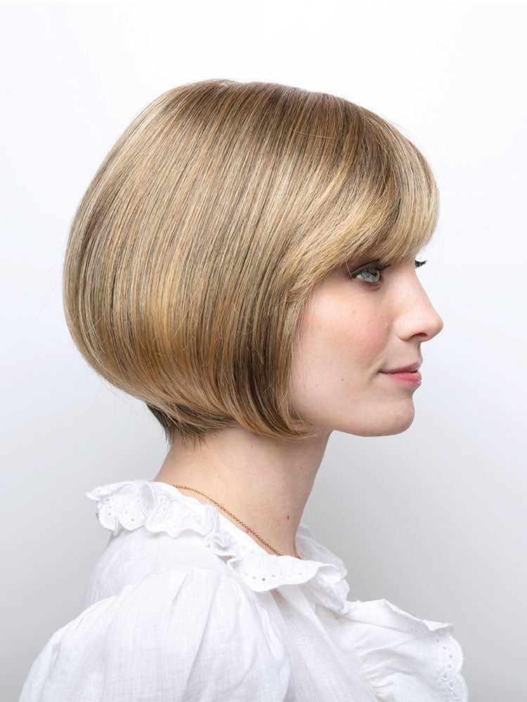 Side view of Erin wig by Amore – a chin-length bob with full fringe, double monofilament top in Harvest Gold.
