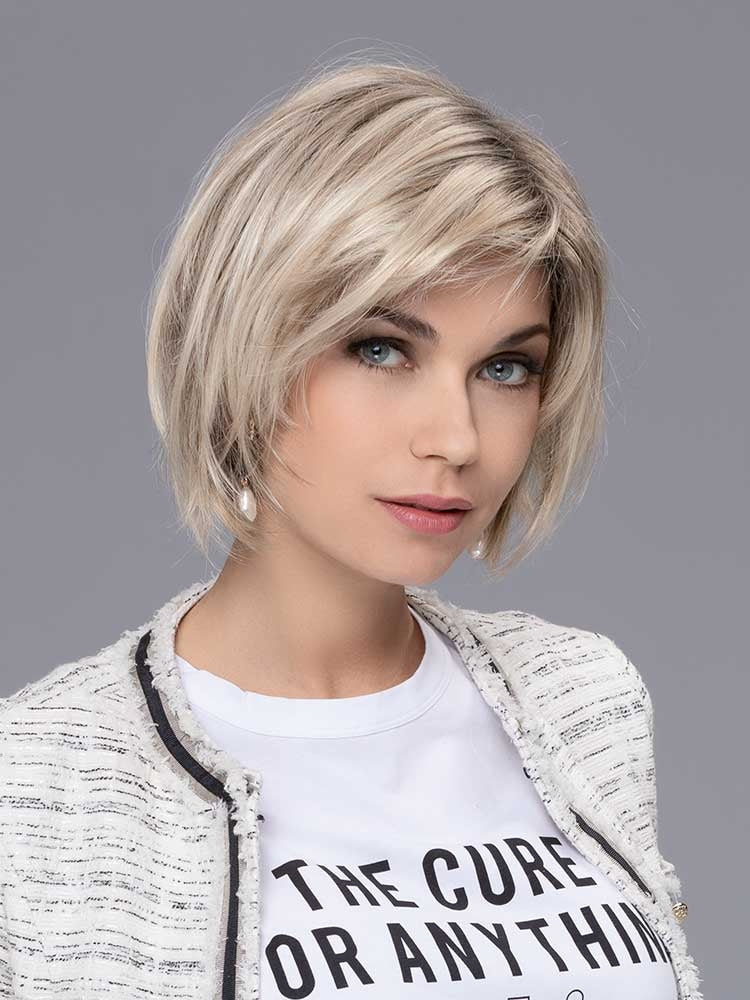 French Mono Part wig by Ellen Wille in Champagne Rooted, a layered bob with dark roots and blonde tones.