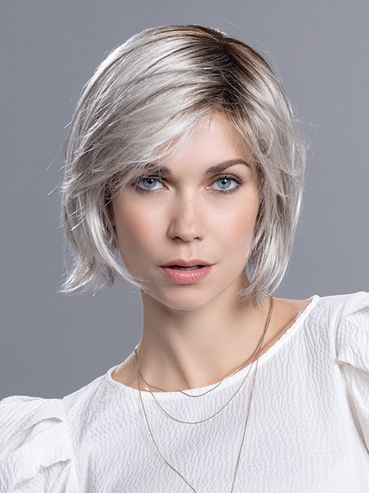 French Mono Part wig by Ellen Wille in Silver Blonde Rooted, a layered bob with a mono part and lace front.