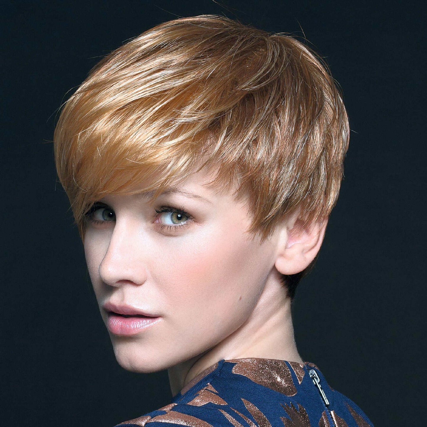 Side view of the Point wig from Ellen Wille Perucci Collection, asymmetrical bob in Light Mango Mix.