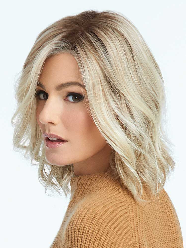 Side view of Simmer wig by Raquel Welch in Shaded Biscuit – beachy waves in a heat-friendly synthetic style.