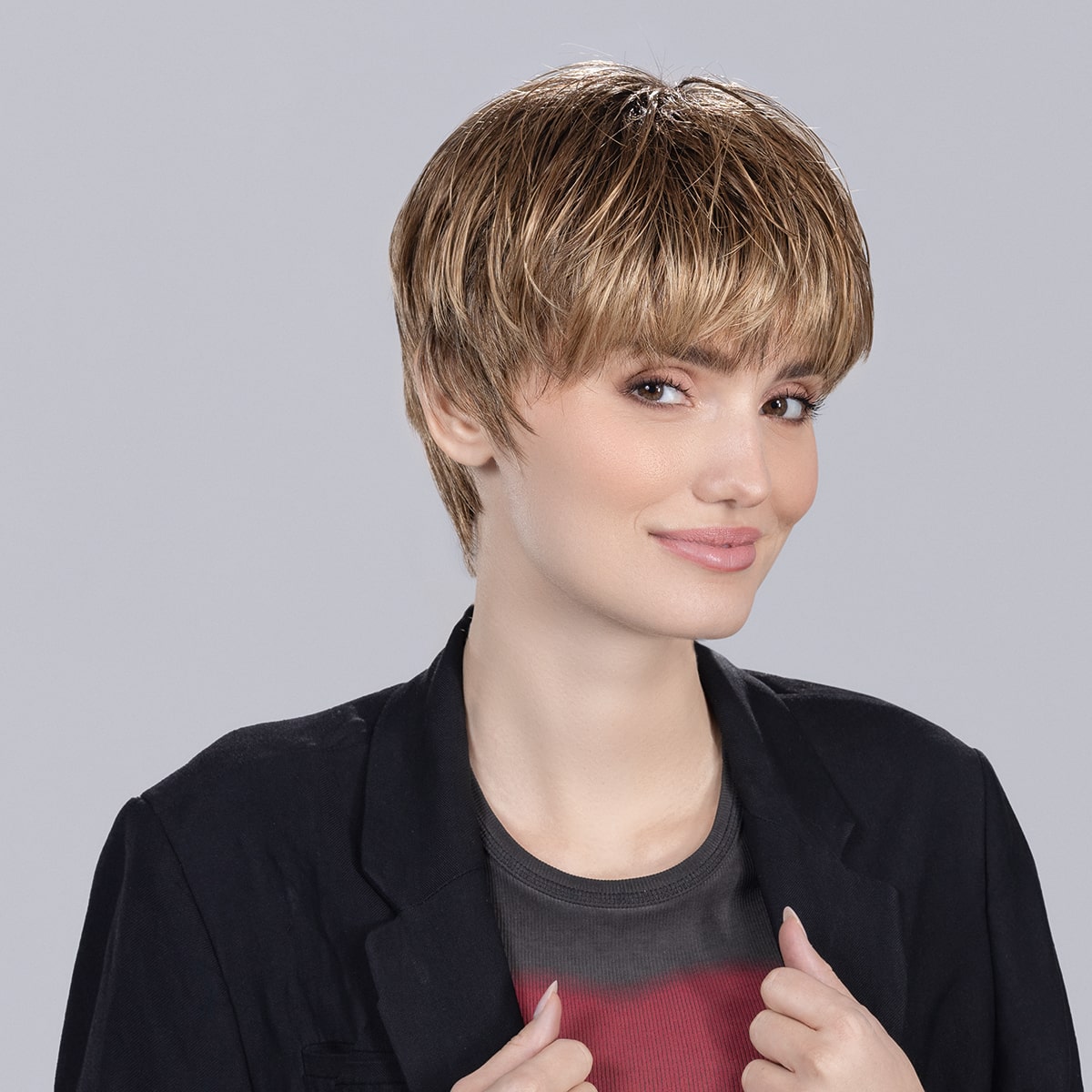Side view of Tool Wig by Ellen Wille from the Perucci Collection – a short, textured synthetic wig with wispy layers in colour Bernstein Rooted.