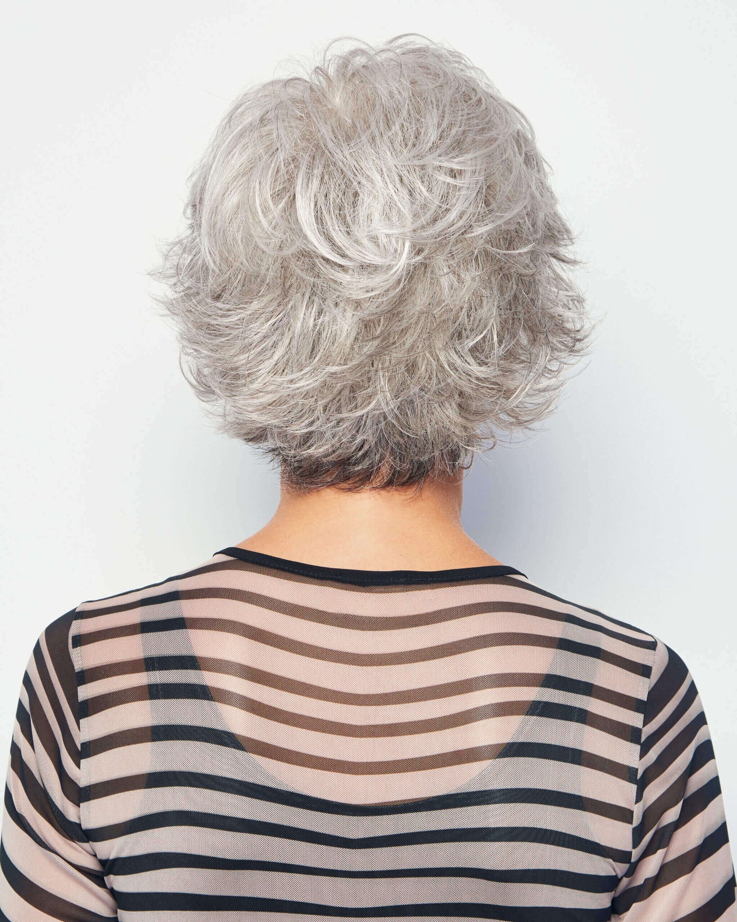 Back view of Voltage wig by Raquel Welch – short, synthetic wig with feathered layers in colour Iced Granita.