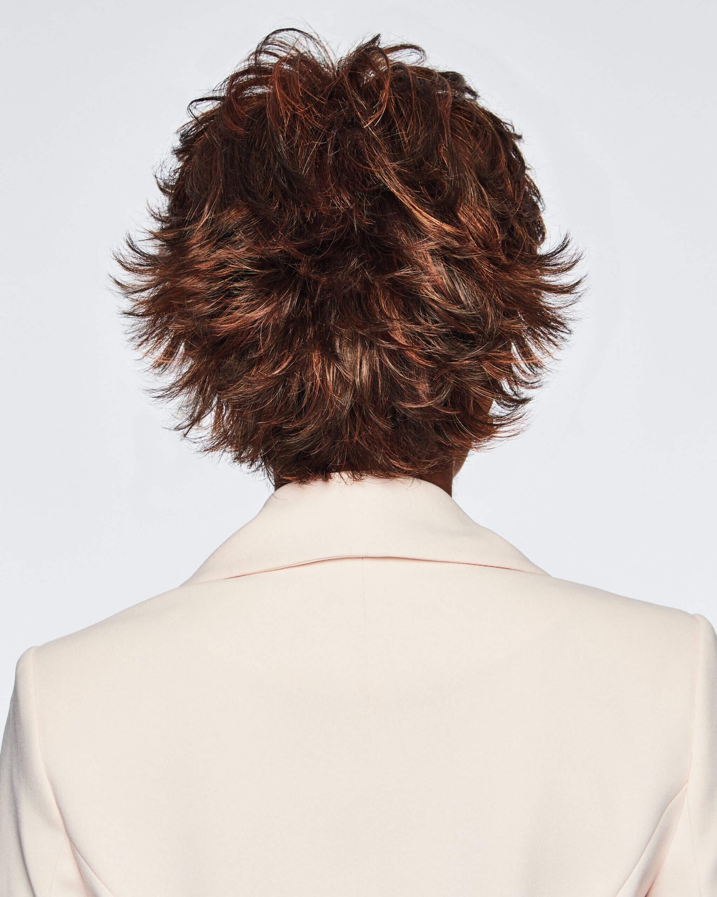 Back view of Voltage wig by Raquel Welch – short, synthetic wig with feathered layers in colour Coppery Mink.