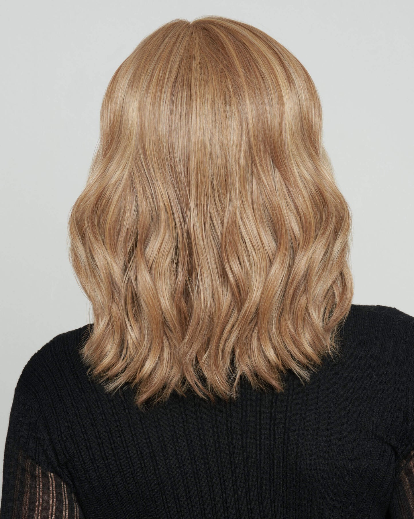 Back view of Wavy Day wig by Raquel Welch – soft, shoulder-length waves with lace front and mono top for a natural look.