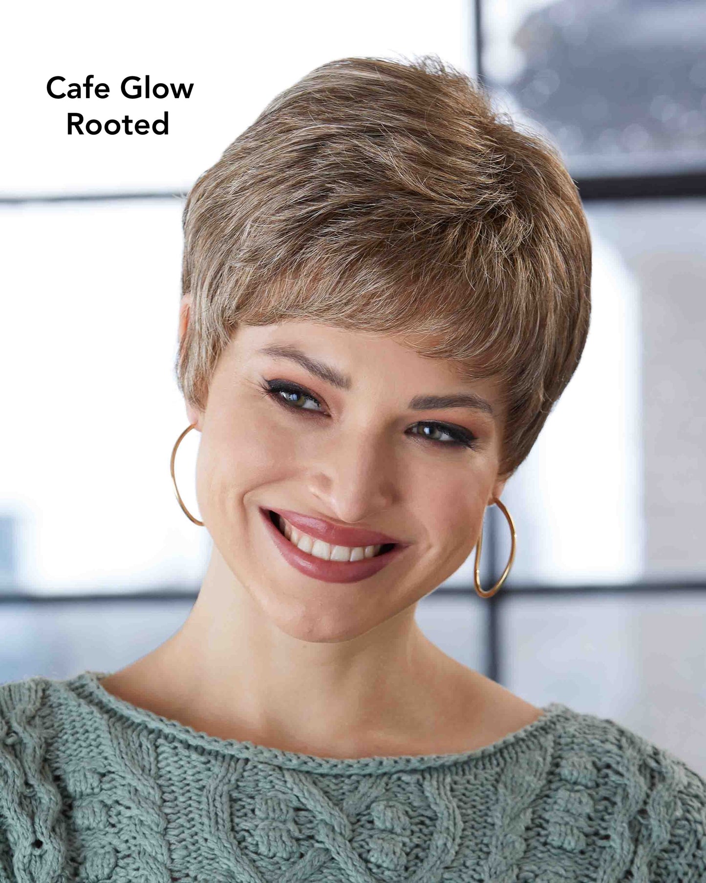 Woman with styled hair labeled 'Cafe Glow Rooted' wearing a green knitted sweater.