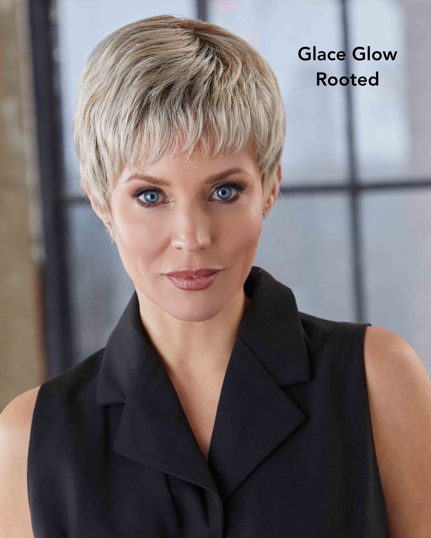Woman with short blonde hair wearing a black top, with 'Glace Glow Rooted' text.