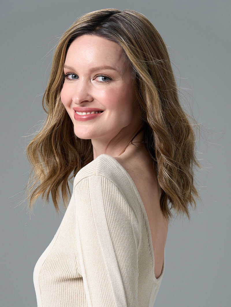 Corey wig with soft waves in Honey Breeze made from heat-friendly EnvyHair and featuring a natural lace front and monofilament top.