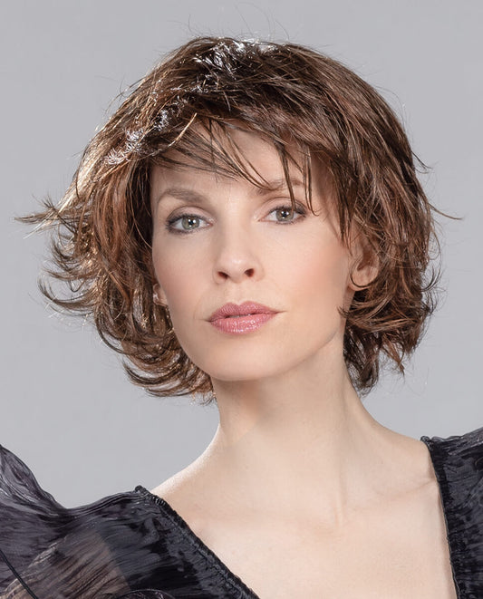 Front view of Flair Mono wig by Ellen Wille in Chocolate Mix, short flicked style with mono top and extended lace front.