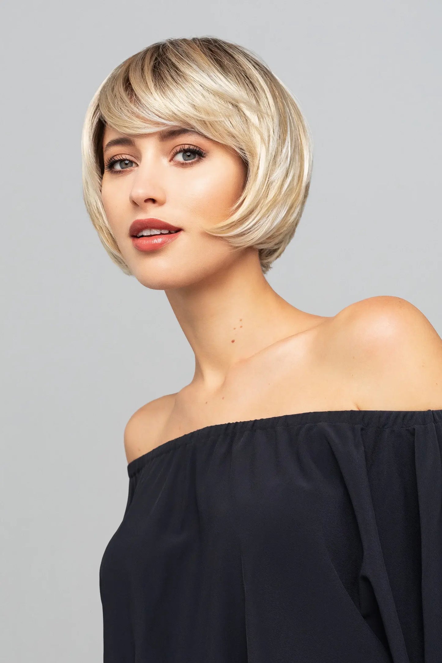 Side profile of Mercedes Mono Lace wig by Gisela Mayer with a mono top. Colour 23/26+12 Blonde Toffee Rooted.