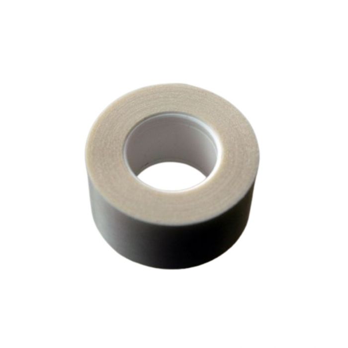 A roll of double-sided wig tape in beige colour.