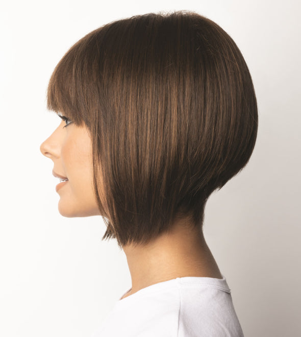 Side view of René of Paris Tori wig – angled bob with a blunt fringe, synthetic fibre in Toasted Brown.