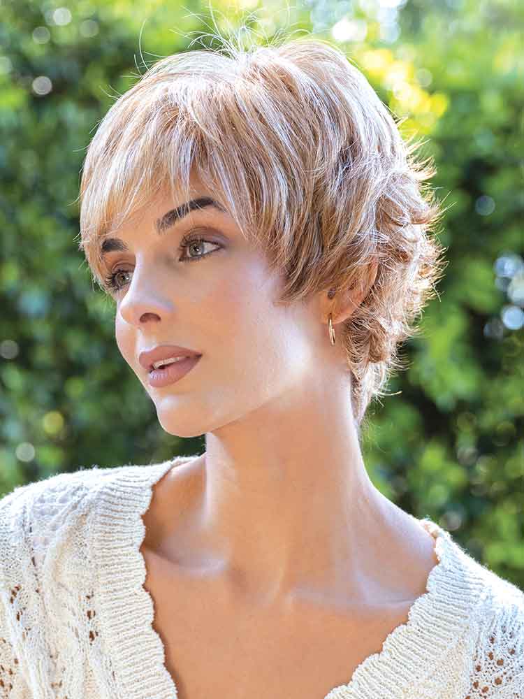 Side view of Tova wig by Amore – short, textured pixie cut with wispy layers and double mono top for a natural scalp look.