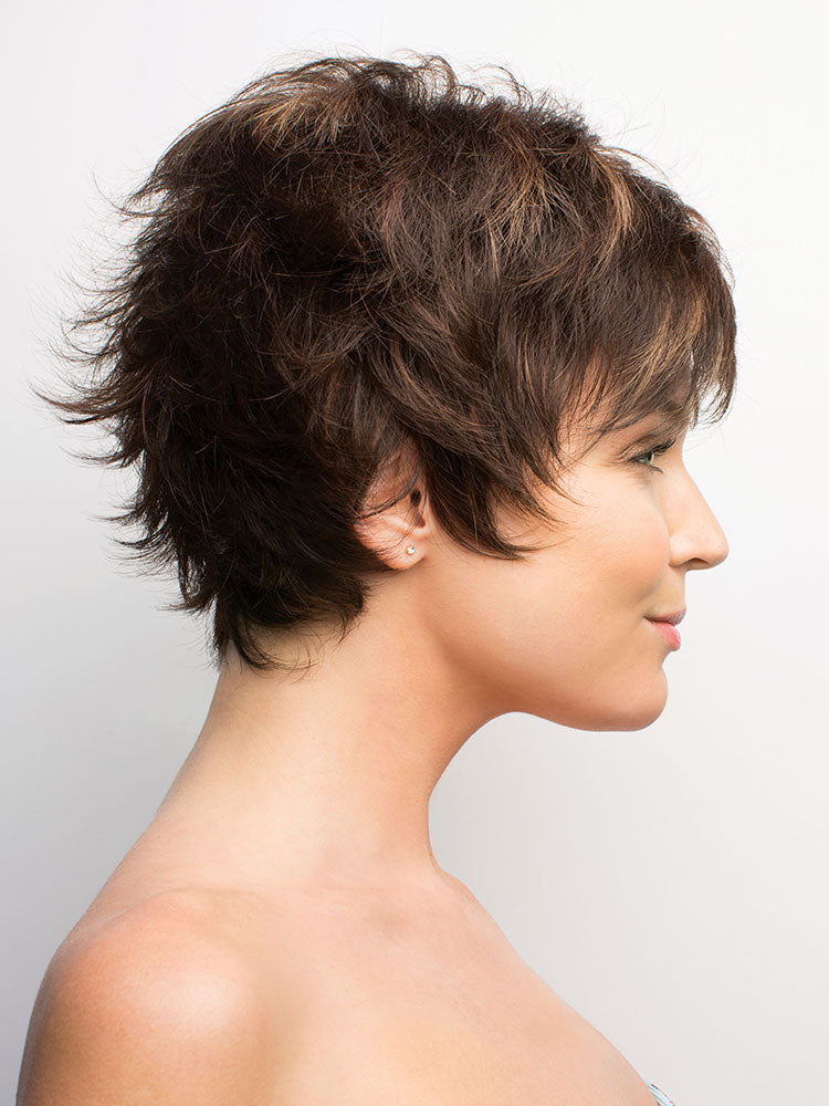 Side view of Tova wig by Amore in Coffee Latte – a short, textured pixie cut with wispy layers and double mono top.