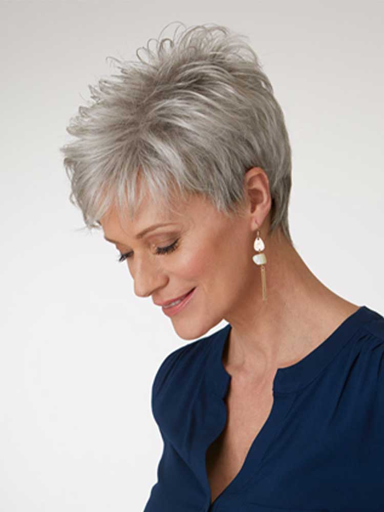 Side view of Katyana wig by Natural Image is a short layered synthetic style with light volume, in Sugared Silver.