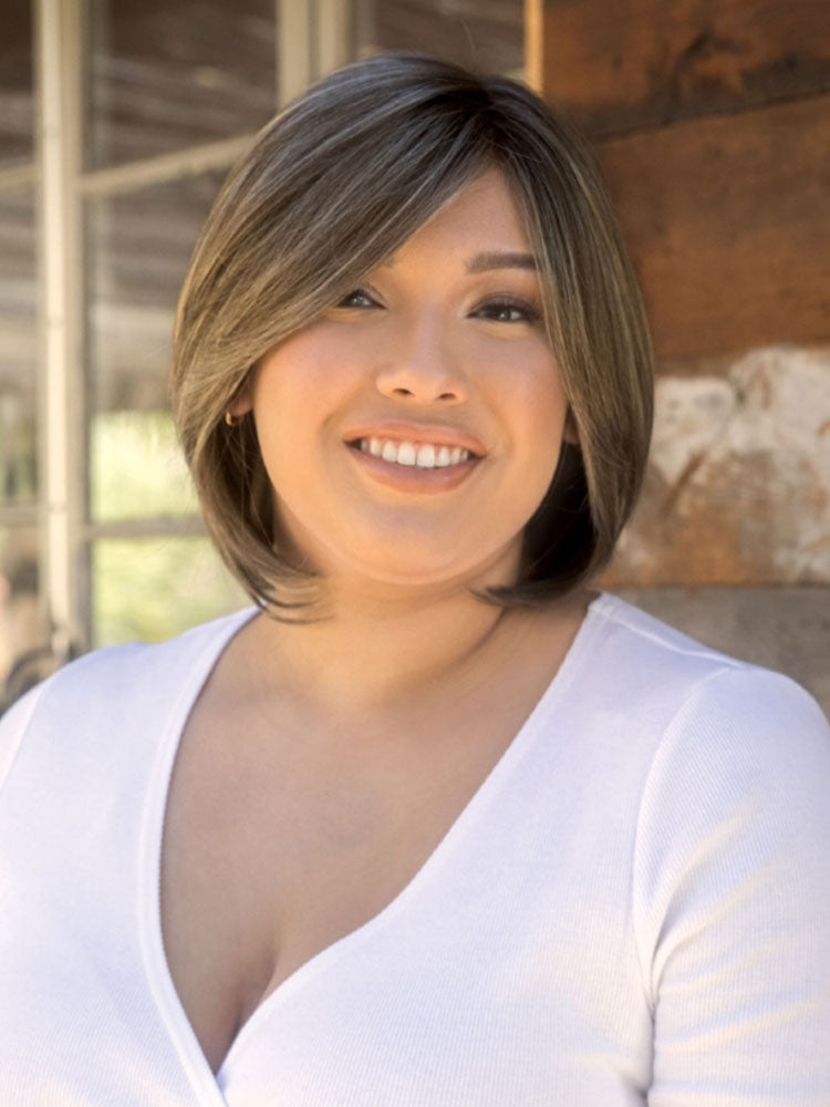 Sybil wig by Amore – long layered bob with face-framing side fringe and natural-looking shape-enhancing layers.