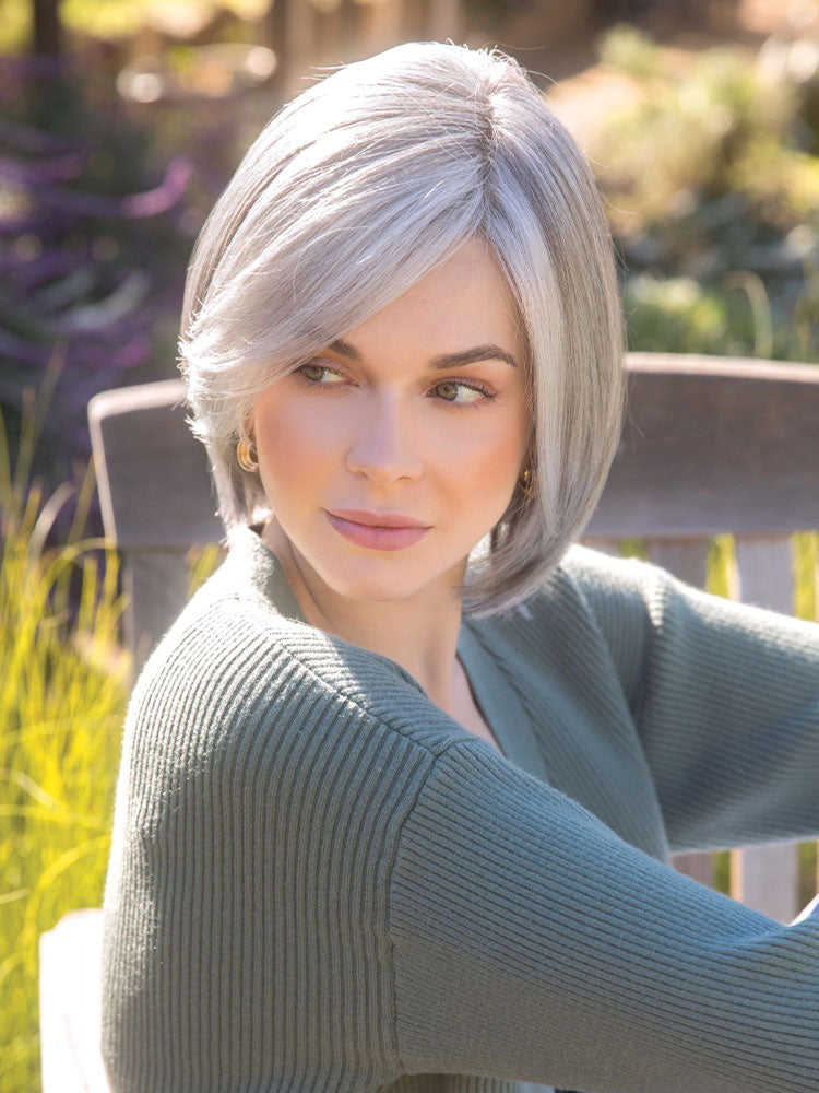 Sybil wig by Amore – in Silverstone, a long layered bob with face-framing side fringe and natural-looking shape-enhancing layers.
